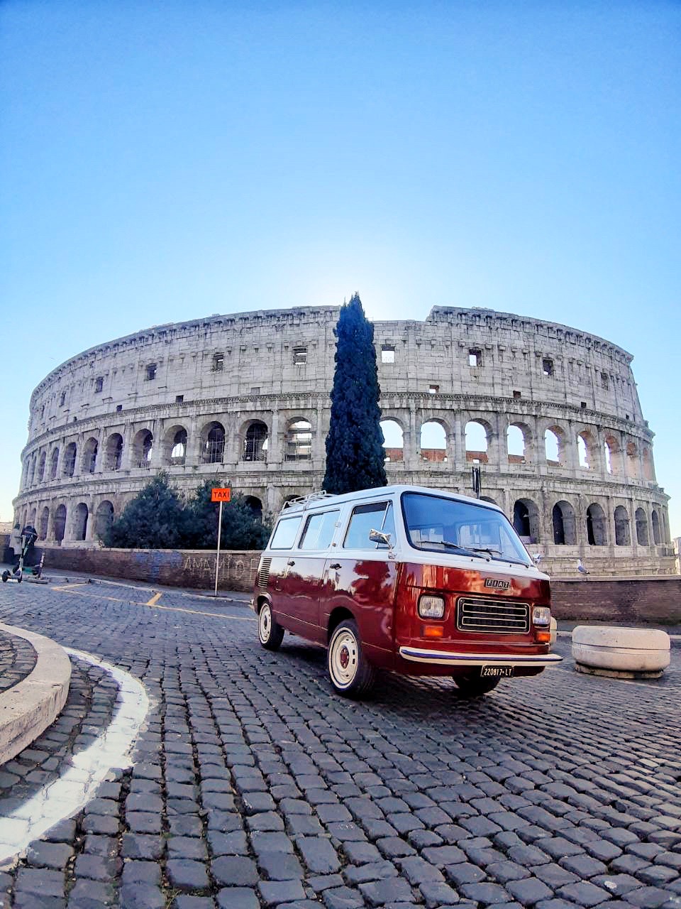 Nando, our 1979 Fiat 900, parked in front of the Colosseum in Rome